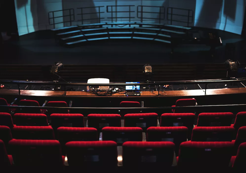 Rows of red seats in a theater