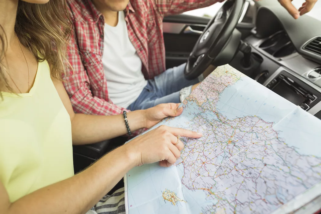 woman pointing finger location navigation map